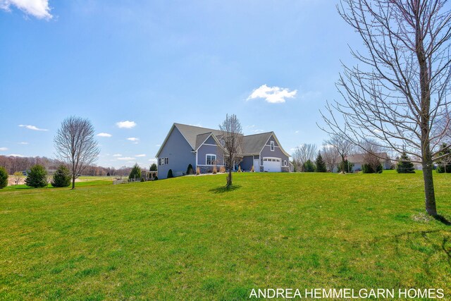 4459 36th St, Hamilton, MI 49419 - view of front of property featuring an attached garage and a front lawn