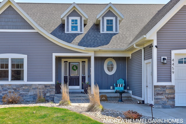 4459 36th St, Hamilton, MI 49419 - property entrance with roof with shingles and stone siding