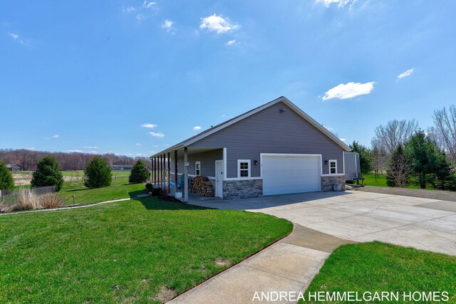 4459 36th St, Hamilton, MI 49419 - view of property exterior with a yard, stone siding, and covered porch