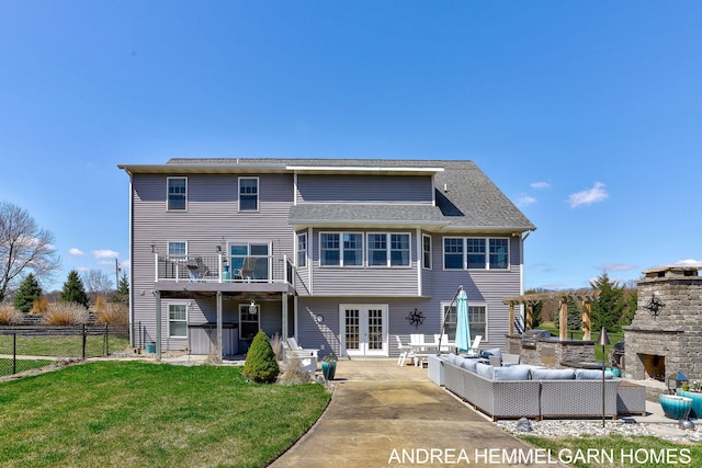 4459 36th St, Hamilton, MI 49419 - rear view of house with fence, a yard, an outdoor living space with a fireplace, a patio area, and french doors