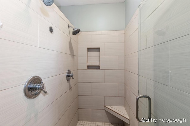 bathroom with tiled shower