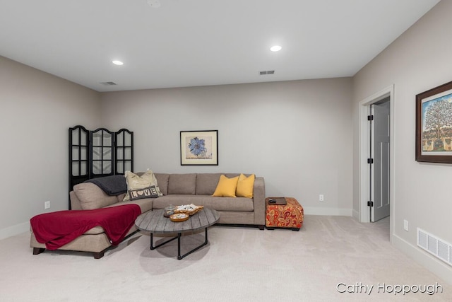 living area with baseboards, recessed lighting, visible vents, and carpet