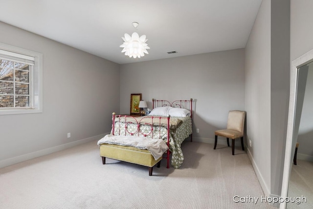 bedroom featuring visible vents, carpet flooring, and baseboards
