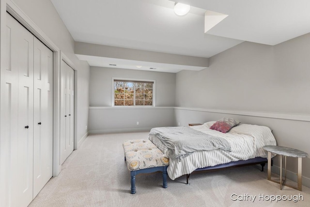 bedroom featuring a closet, carpet flooring, and baseboards