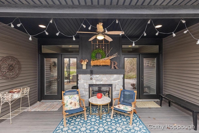 wooden deck featuring ceiling fan