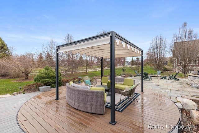 wooden terrace with a gazebo and an outdoor living space with a fire pit