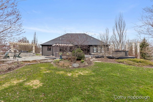 rear view of property with a patio area and a lawn