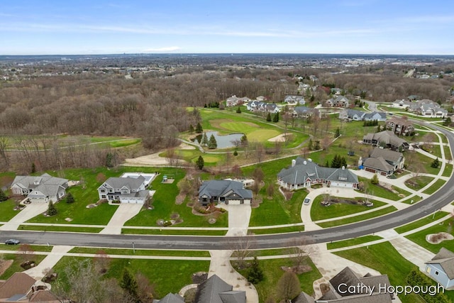 drone / aerial view featuring a residential view and a water view