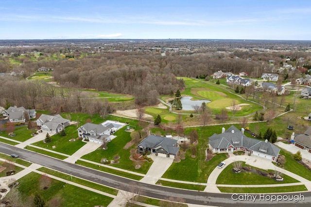 drone / aerial view featuring a residential view, a water view, and view of golf course