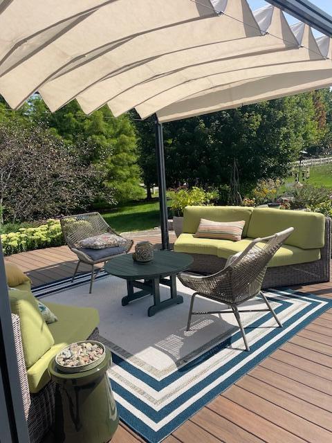 view of patio / terrace with a deck and an outdoor living space