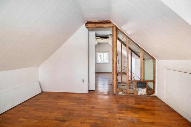 bonus room featuring wood finished floors and lofted ceiling