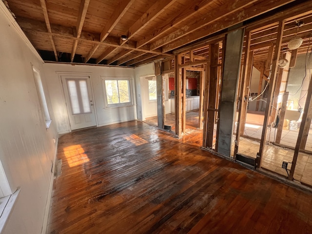 unfurnished living room with wood-type flooring