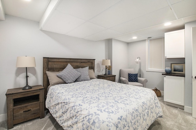 bedroom with recessed lighting, baseboards, and light carpet