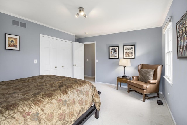 bedroom featuring visible vents, crown molding, a closet, baseboards, and light colored carpet
