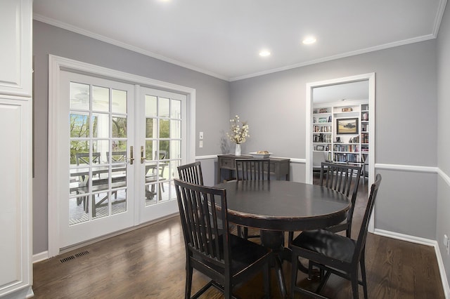 dining area with visible vents, crown molding, dark wood-style flooring, recessed lighting, and french doors