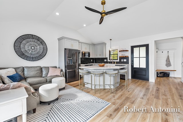 2301 Schimperle Dr NE, Grand Rapids, MI 49525 - living room with lofted ceiling, ceiling fan, light wood finished floors, and recessed lighting