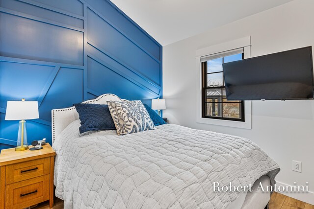 2301 Schimperle Dr NE, Grand Rapids, MI 49525 - bedroom featuring wood finished floors and baseboards