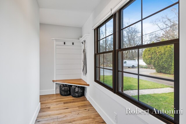 2301 Schimperle Dr NE, Grand Rapids, MI 49525 - mudroom featuring wood finished floors and baseboards