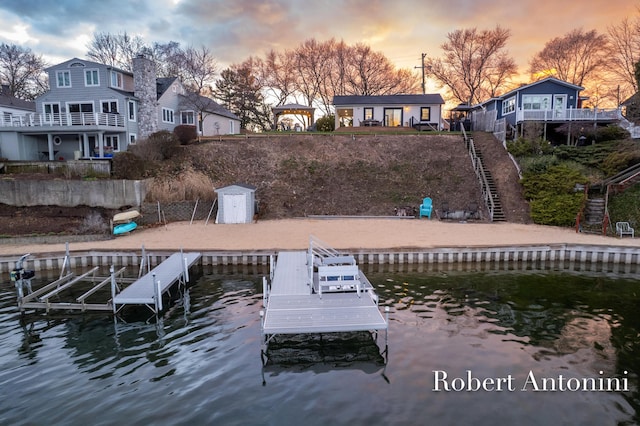 2301 Schimperle Dr NE, Grand Rapids, MI 49525 - dock area featuring a water view and boat lift
