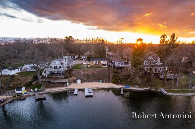 2301 Schimperle Dr NE, Grand Rapids, MI 49525 - aerial view at dusk of a water view and a residential view