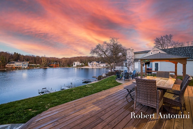 2301 Schimperle Dr NE, Grand Rapids, MI 49525 - wooden terrace featuring a water view, a gazebo, outdoor dining space, a yard, and a dock