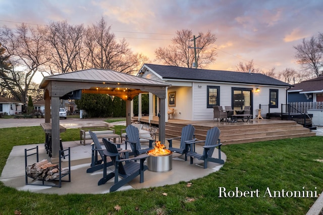 2301 Schimperle Dr NE, Grand Rapids, MI 49525 - rear view of property featuring a fire pit, a gazebo, a deck, and a lawn