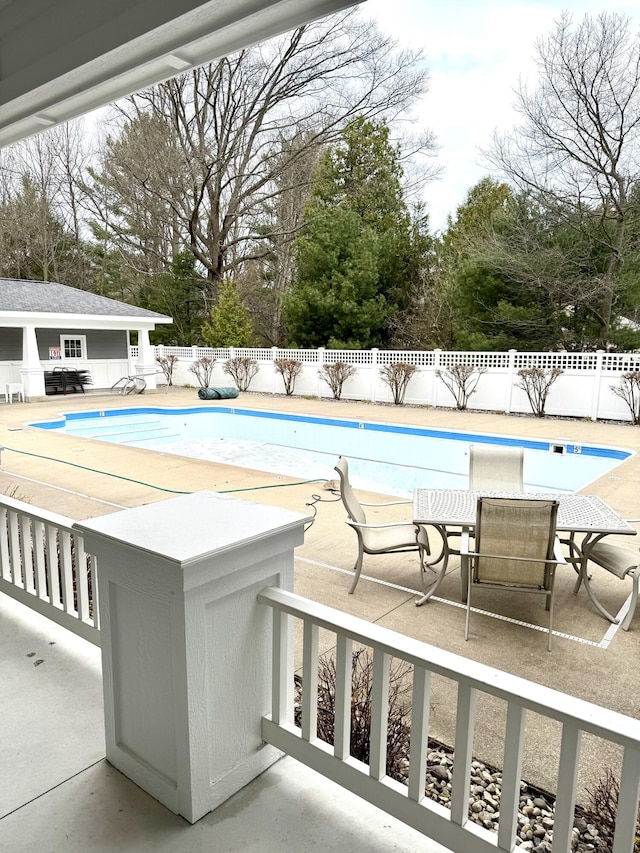 8 Georgia Ct, Pentwater, MI 49449 - view of pool featuring a fenced in pool, fence, an outdoor structure, and a patio area