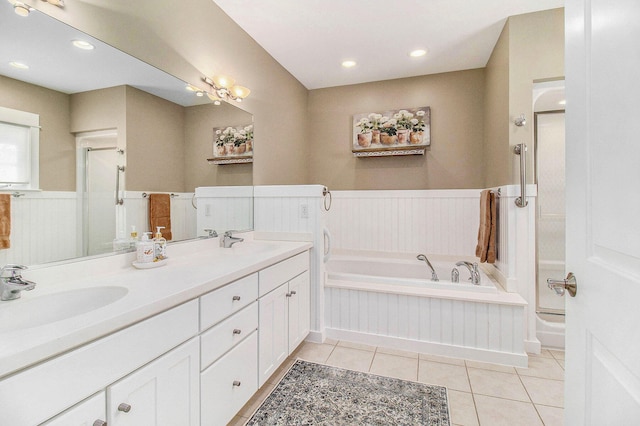 8 Georgia Ct, Pentwater, MI 49449 - full bathroom with a sink, a wainscoted wall, tile patterned flooring, and a bath