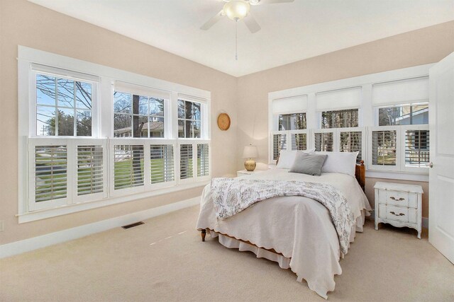 8 Georgia Ct, Pentwater, MI 49449 - carpeted bedroom featuring baseboards, visible vents, and ceiling fan