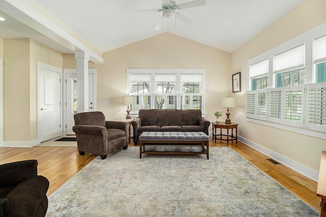 8 Georgia Ct, Pentwater, MI 49449 - living area with visible vents, wood finished floors, baseboards, a ceiling fan, and vaulted ceiling