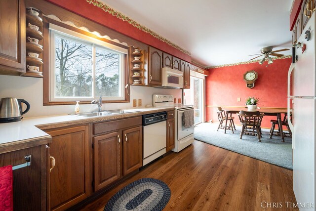 15230 Van Buren St Unit B, Holland, MI 49424 - kitchen featuring a healthy amount of sunlight, open shelves, a sink, and white appliances