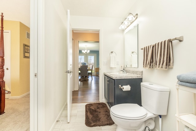 48320 Martz Rd, Van Buren Twp, MI 48111 - bathroom featuring vanity, a chandelier, baseboards, toilet, and visible vents