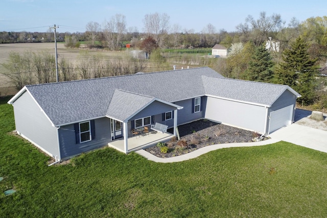 48320 Martz Rd, Van Buren Twp, MI 48111 - rear view of house with roof with shingles, concrete driveway, and a lawn