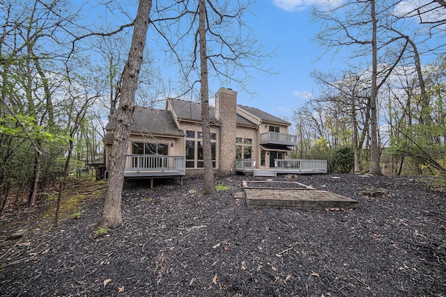 2925 Exmoor Rd, Ann Arbor, MI 48104 - back of house featuring a wooden deck and a chimney
