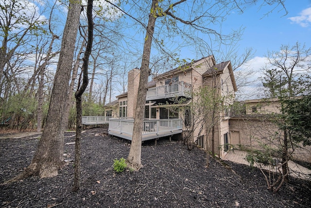2925 Exmoor Rd, Ann Arbor, MI 48104 - rear view of property featuring a balcony and a deck