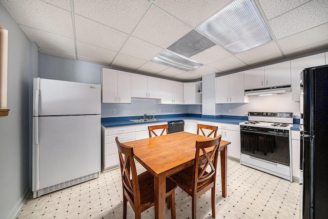 2925 Exmoor Rd, Ann Arbor, MI 48104 - kitchen with freestanding refrigerator, range with electric stovetop, light floors, under cabinet range hood, and a paneled ceiling