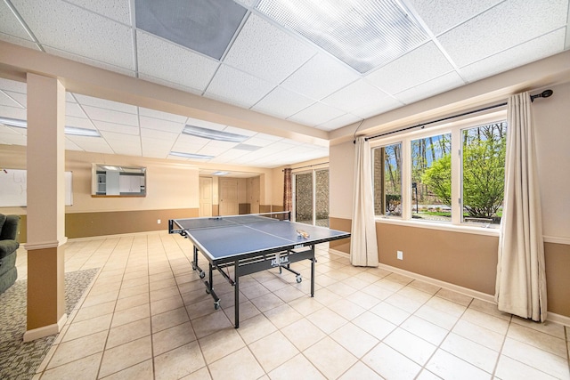 2925 Exmoor Rd, Ann Arbor, MI 48104 - game room with a drop ceiling, baseboards, and light tile patterned floors