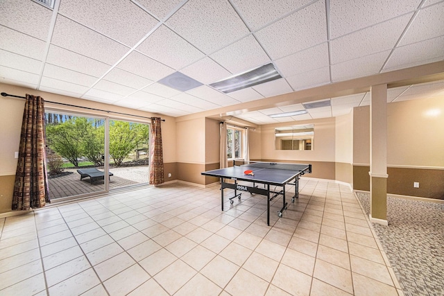 2925 Exmoor Rd, Ann Arbor, MI 48104 - rec room with a drop ceiling, baseboards, and light tile patterned flooring