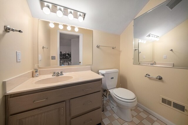 2925 Exmoor Rd, Ann Arbor, MI 48104 - bathroom featuring toilet, tile patterned flooring, vanity, and baseboards