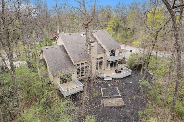 2925 Exmoor Rd, Ann Arbor, MI 48104 - rear view of house with a shingled roof, a deck, a balcony, and a view of trees