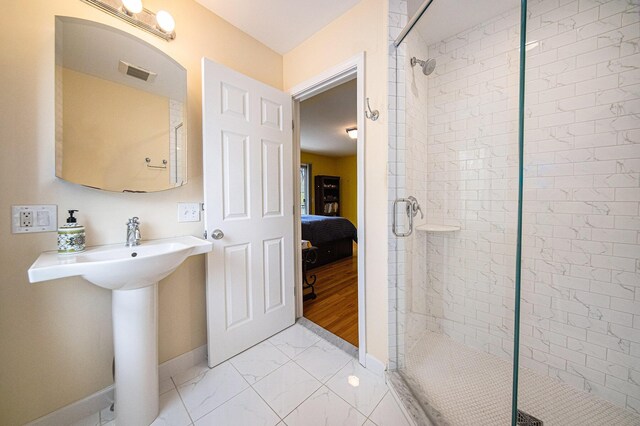 2925 Exmoor Rd, Ann Arbor, MI 48104 - full bath with baseboards, marble finish floors, and a shower stall