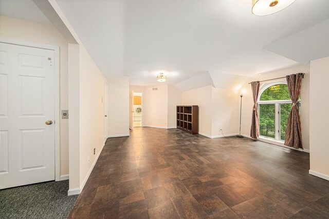 2925 Exmoor Rd, Ann Arbor, MI 48104 - unfurnished living room featuring dark wood-type flooring and baseboards
