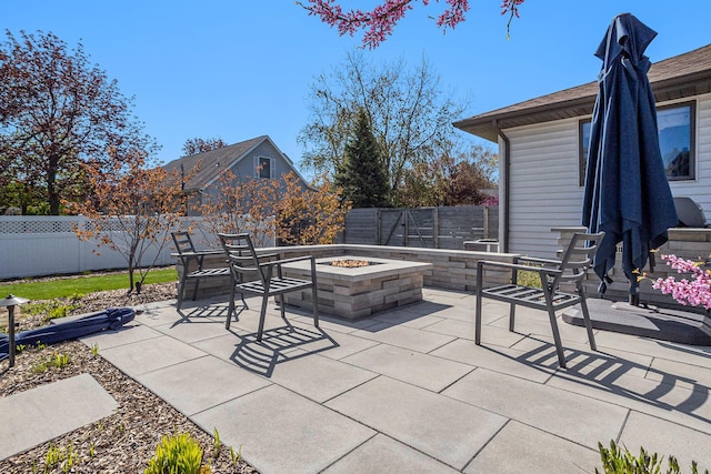 55 Gabriel Dr, South Haven, MI 49090 - view of patio / terrace with a fire pit and a fenced backyard