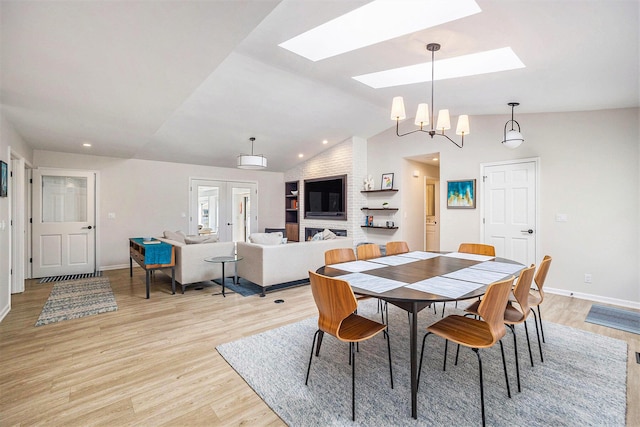 55 Gabriel Dr, South Haven, MI 49090 - dining room with a skylight, light wood-type flooring, lofted ceiling, baseboards, and a chandelier