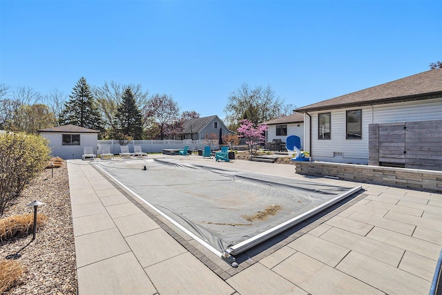 55 Gabriel Dr, South Haven, MI 49090 - view of pool with a patio area, an outbuilding, and a fenced backyard
