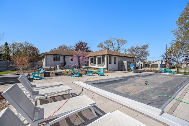55 Gabriel Dr, South Haven, MI 49090 - rear view of house featuring fence and a patio area