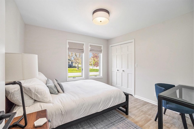 55 Gabriel Dr, South Haven, MI 49090 - bedroom with light wood-type flooring, baseboards, and a closet