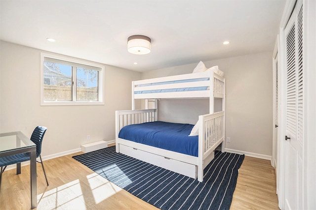 55 Gabriel Dr, South Haven, MI 49090 - bedroom with wood finished floors, baseboards, a closet, and recessed lighting