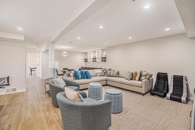 55 Gabriel Dr, South Haven, MI 49090 - living room featuring bar, light wood-style flooring, recessed lighting, and baseboards
