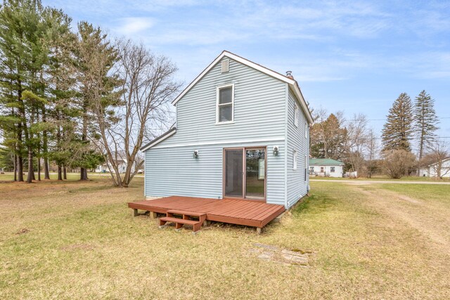 430 N Perry St, Barryton, MI 49305 - back of house featuring a yard and a deck